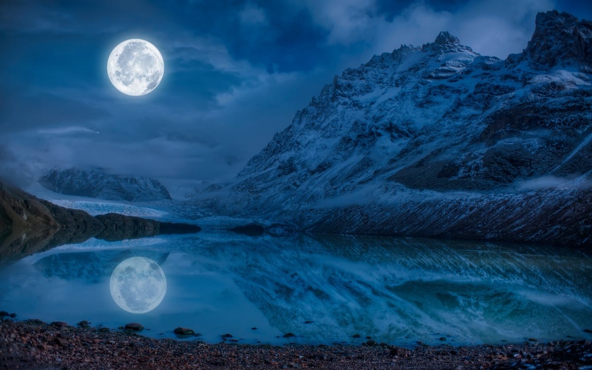 full-moon-near-snowcap-mountain